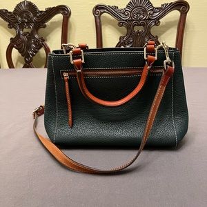 Dooney & Bourke navy blue satchel bag with tan shoulder strap